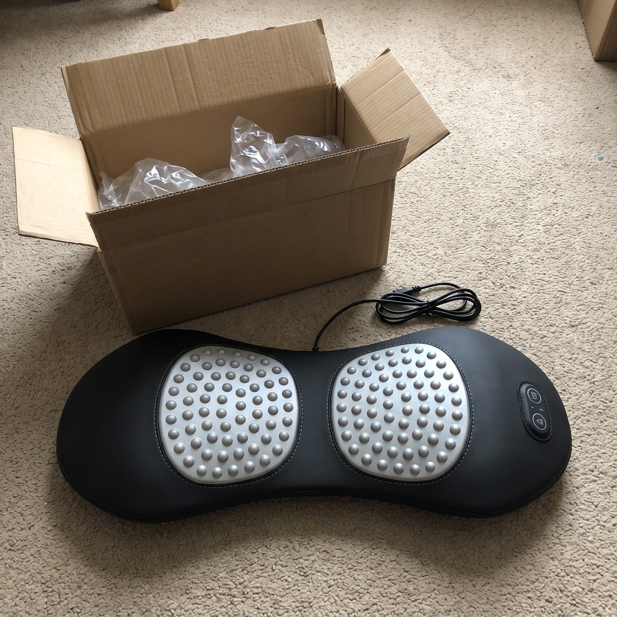 Easeback beside its open shipping box