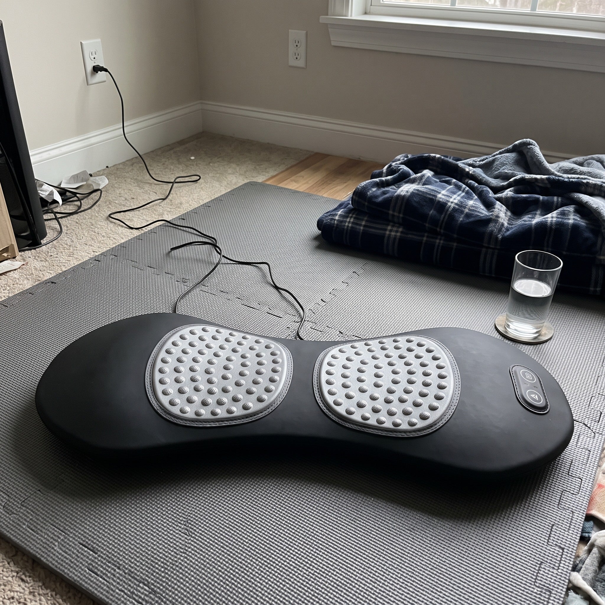 Easeback ready on a mat beside a blanket